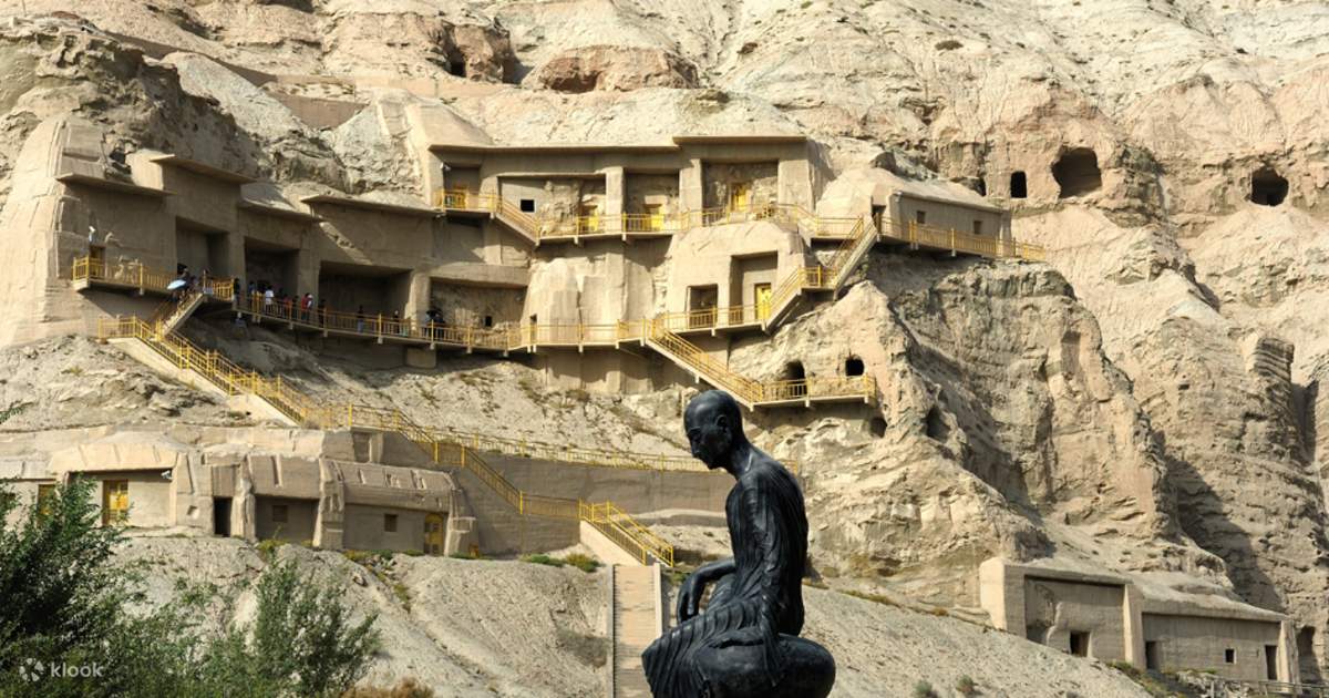 Rock-cut cave landscape and seated contemplative figure as a visual reference for personal retreat